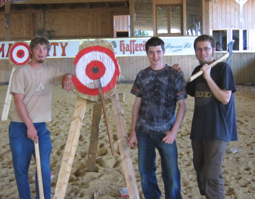 The three throwers from Switzerland with the remains of the target.