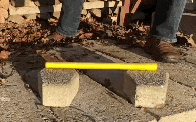 Testing a fiberglass axe handle with my sledgehammer.